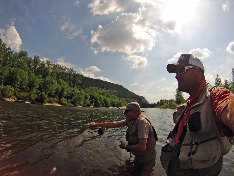 Fly fishing initiation looking for trout and grayling in Dordogne